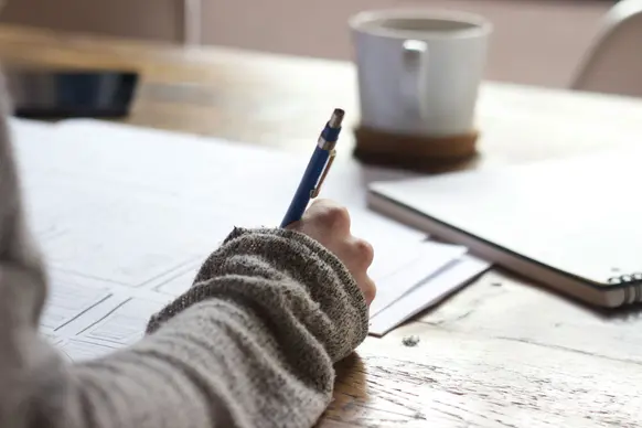 a picture of someone writes 